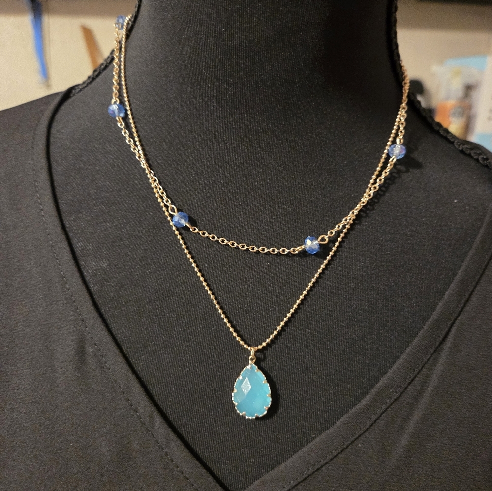 Charming Charlie Gold Necklace with Blue Accents